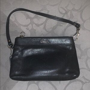 Coach leather perforated wristlet.
